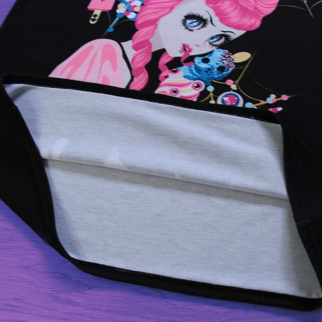 A unique perspective unfolds in this shot, exposing the meticulous craftsmanship of the ‘Demon Kawaii Ice Cream Pastel Goth’ t-shirt. Delving beyond the surface, the pastel goth, kawaii, yami kawaii, and shoujo manga-inspired design reveals itself alongside the intricate seams and inner details. The inside of the shirt mirrors the artistry, adding a layer of craftsmanship to the overall charm.
