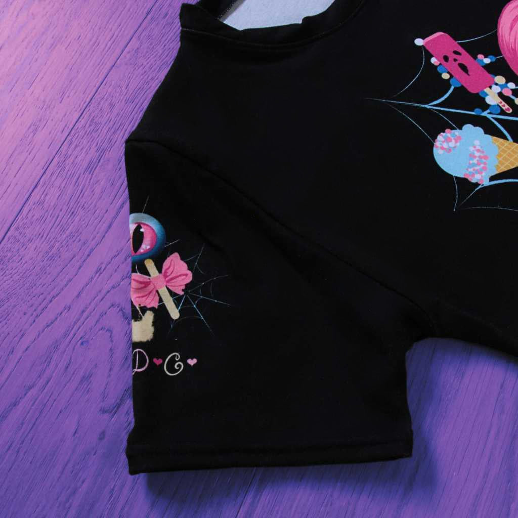 Zooming in on the sleeve, the ‘Demon Kawaii Ice Cream Pastel Goth’ t-shirt showcases meticulous detailing. Pastel goth, kawaii, yami kawaii, and shoujo manga elements come alive on the sleeve, creating a visual symphony of whimsy. The sleeve’s intricate design enhances the overall appeal, making it a standout feature of this charming shirt.