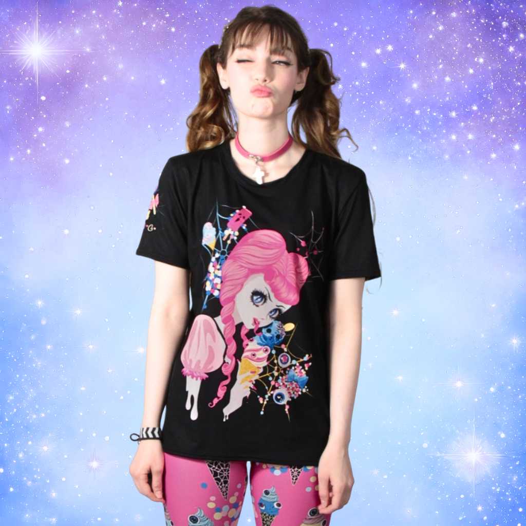On a model, the ‘Demon Kawaii Ice Cream Pastel Goth’ t-shirt comes to life. The pastel goth, kawaii, yami kawaii, and shoujo manga influences harmonize as the charming design showcases a demon enjoying an ice cream against a dreamy pastel background. The shirt’s vibrant visuals seamlessly blend with the wearer’s style, creating a captivating and whimsical fashion statement.
